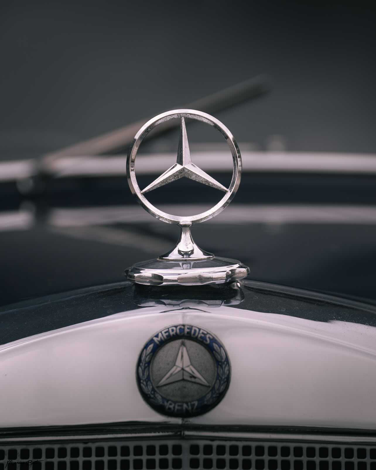 The three-pointed star hood ornament